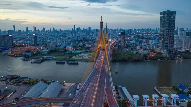 Urban aerial timelapse day to twilight night with Bhumipol bridge in Bangkok, Thailand