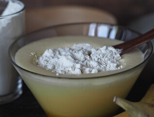 Confectionery background. Stage of cooking biscuit with banana. Cooking a pie of three ingredients.
