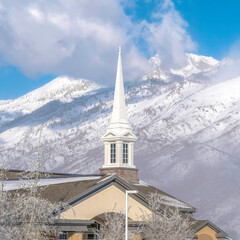 Square frame Magnificent view of snow covered Wasatch Mountain with church in the foreground