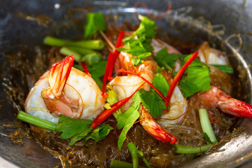 Fototapeta na wymiar Thai dish with king prawns on the pan