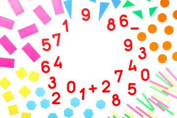 Multicolored plastic figures and numbers on a white background. Educational games for children. Math and calculation skills.