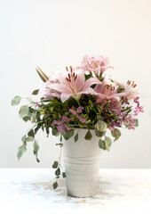 Fototapeta na wymiar Pink lily on a pot