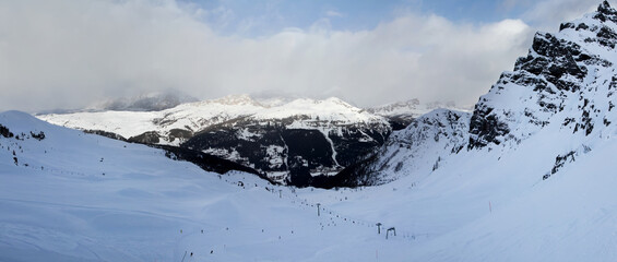 Panoramic winter view of Alpine mountains. Sella Ronda. Marmolada. Dolomites. South Tirol. Italy.