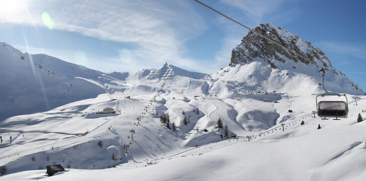 Panoramic winter view of Pordoi Pass ski area. Sella Ronda (Sella Group) Dolomite Alps. Trentino-Alto Adige. Italy.