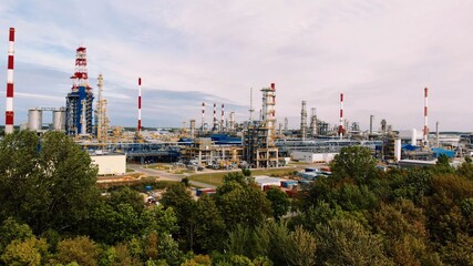 Fototapeta na wymiar Aerial shot over a pipe infrastructure in an oil refinery in Gdansk, 