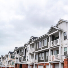 Square frame Long receding row of urban apartments day light