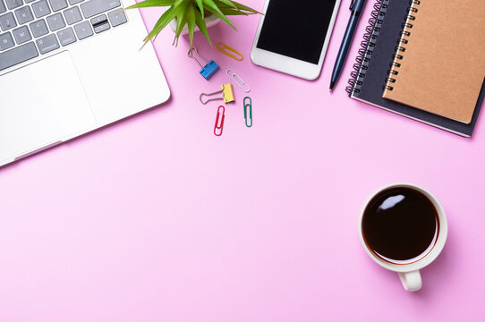 Workplace Of Pink Office Desk Table With Equipment Other Office Supplies