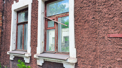Ruined old house. And the blue sky. The remains of old houses. Abandoned city. The city of ghosts. The ruins of old historic buildings destroyed by an earthquake.