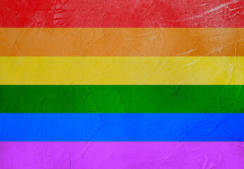 LGBT flag on the wall with texture. Rainbow flag. LGBT Pride Month.