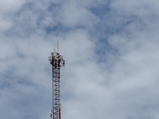 Telecommunication tower of 4G and 5G cellular. Cell Site Base Station. Wireless Communication Antenna Transmitter. Telecommunication tower with antennas against blue sky background.