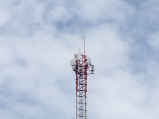 Telecommunication tower of 4G and 5G cellular. Cell Site Base Station. Wireless Communication Antenna Transmitter. Telecommunication tower with antennas against blue sky background.