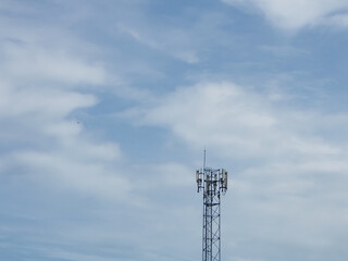 Telecommunication tower of 4G and 5G cellular. Cell Site Base Station. Wireless Communication Antenna Transmitter. Telecommunication tower with antennas against blue sky background.