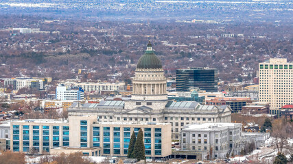 Fototapeta na wymiar Panorama Utah State Capitol Building against a sweeping view of Salt Lake City in winter
