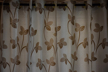 Picture of modern white color curtain with golden color printed flower design