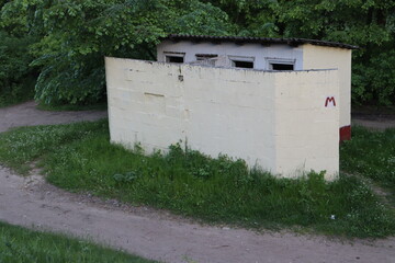 Fototapeta na wymiar typical village toilet with symbols in Belarus