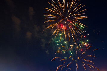 Brightly colorful fireworks 4th July fireworks. Fireworks display on dark sky background. - 357862572