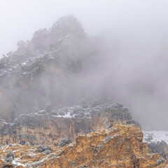 Square frame Misty clouds over the rugged peak of rocky mountain in Provo Canyon Utah