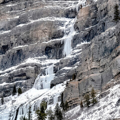 Obraz na płótnie Canvas Square crop Bridal Veil Falls in Provo Canyon with snow ice and evergreen trees in winter