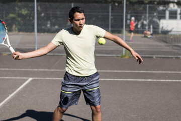 professional tennis player playing with racket