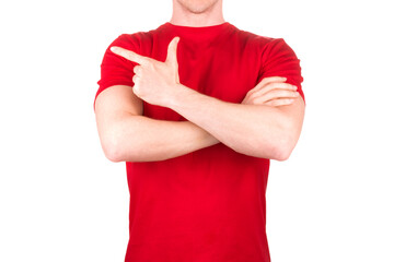 Man in red t-shirt pointing arm and fingers on the side isolated white