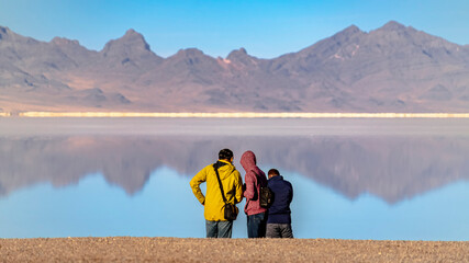Panorama frame Three tourists in Bonneville Salt Flats, Utah, USA
