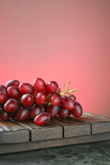 Red grapes on a red background