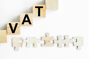 VAT inscription on wooden cubes on a white background.