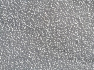 White rough wall texture viewed up close with background