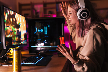 Image of displeased girl expressing irritation while playing video game