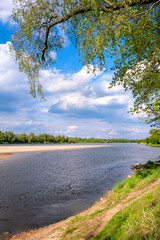 Fototapeta na wymiar Panoramic view of Vistula river waters with sandy islands and shores of Lawice Kielpinskie natural reserve near Lomianki town north of Warsaw in central Mazovia region of Poland