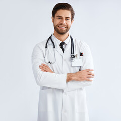 Studio portrait of a focused looking male doctor against a white background