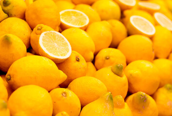 Lemons exposed in the market. Yellow colors. fruits in the market. Background. Selective blur.
