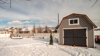 Panorama Winter garden with snow and footprints day light