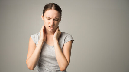 Tired woman feeling pain, massaging tense muscles