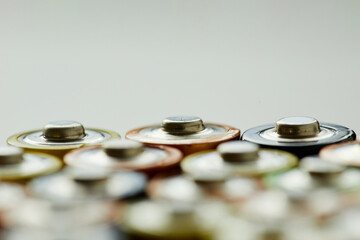 Close-up of alkaline battery against the grey background