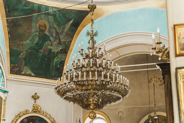 Big chandelier in the church. Church interior. Orthodox faith. Equipment for praying. Pray for...
