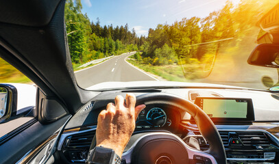 hands of car driver on steering wheel, road trip, driving on highway road