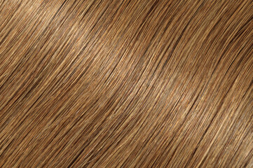 close up of single piece clip in straight light brown human hair extensions 