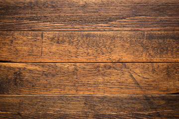 Old wooden brown planks table background backdrop. Horizontal top view of old rustic oak wood table