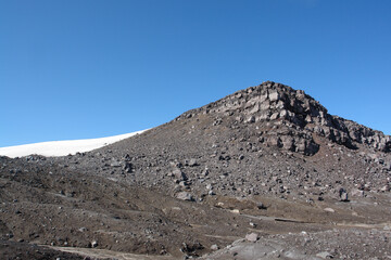 View from the edge of a crater to the top (1829 m) of Gorely volcano, Kamchatka Peninsula, Far East Russia