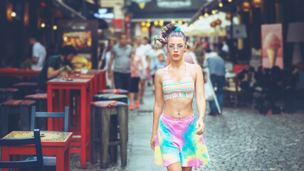 Obraz na płótnie Canvas Cool funky teenage girl with crazy hair walking on city streets enjoying weekend vibes