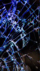 Multi-colored and bright broken smartphone screen close-up.