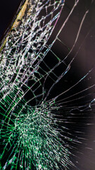 Multi-colored and bright broken smartphone screen close-up.