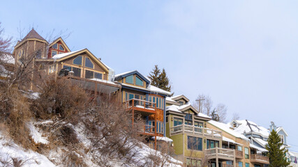 Fototapeta na wymiar Panorama Homes with snowy roofs and balconies in scenic Park City Utah neighborhood