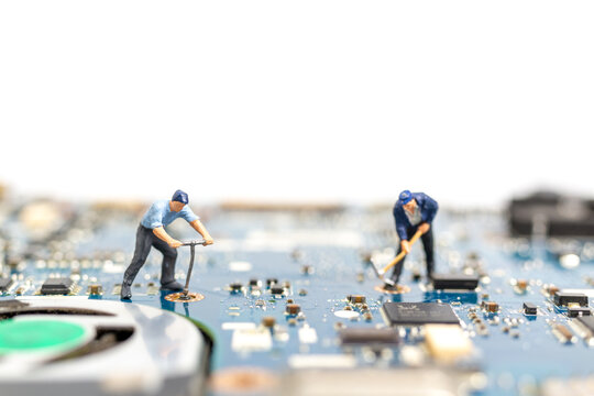 Miniature people working on cpu board, Technology concept