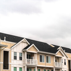 Square Modern apartment complex with covered parking day light