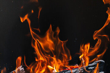 burning firewood in a barbecue or barbecue. photo of a fire with flames in the street