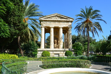 Fototapeta na wymiar Malta, La Valletta, Barakka Lower Gardens, Monument to Sir Alexander Ball, which is an outstanding feature in the form of a neoclassical temple located in the center of the garden.