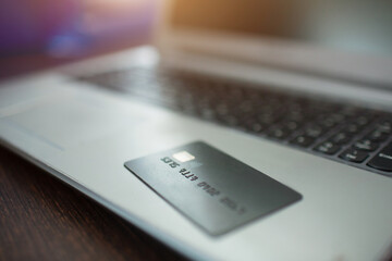 Online shopping concept. Close-up credit card lies on a laptop keyboard