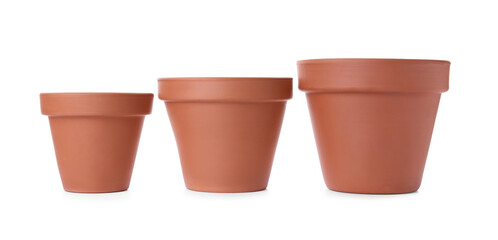 Stylish terracotta flower pots isolated on white